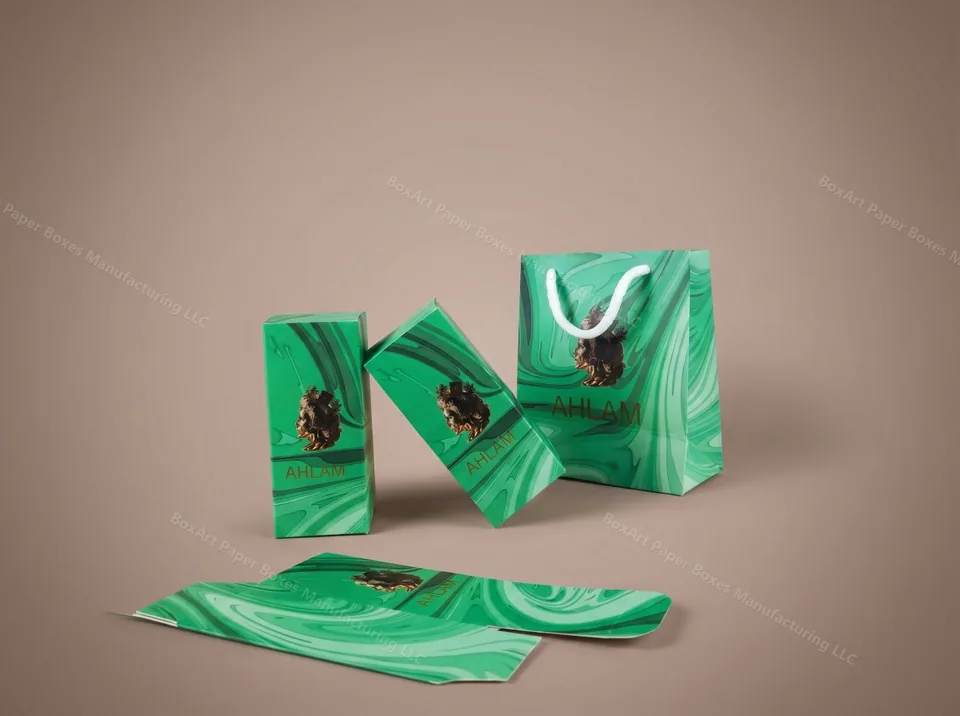 Ahlam Perfume Set — Box & Shopping Bag — luxury perfume boxes manufactured in Dubai by BOXART — Emerald marble folding cartons with gold-foil bust and matching shopping bag — full retail set for Ahlam perfume.