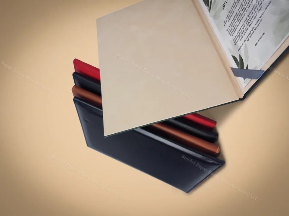 Ahdhia Kraft Leatherette Book-Style Folder — luxury corporate gifting manufactured in Dubai by BOXART — Book-style rigid folder set in black, brown, and red leatherette with printed inner pages — corporate gifting.