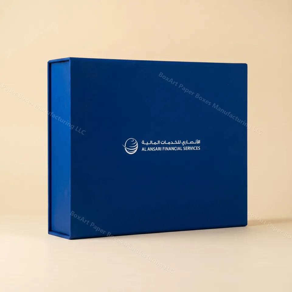 Al Ansari Financial Services — Corporate Box — luxury corporate gifting manufactured in Dubai by BOXART — Rigid magnetic-closure box in signature Al Ansari blue with silver-foil bilingual wordmark — corporate gifting.