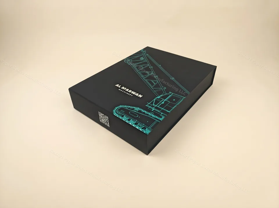 Al Marwan Machinery Magnetic Box — luxury magnetic boxes manufactured in Dubai by BOXART — Signature magnetic-closure rigid box with soft-touch black finish, teal foil crane illustration and QR code.