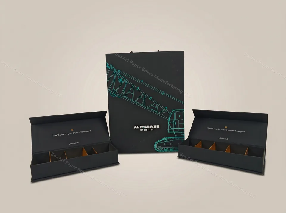 Al Marwan Machinery Gift Set — luxury magnetic boxes manufactured in Dubai by BOXART — Bespoke corporate gift ensemble featuring cyan foil stamping on matte black rigid boxes with compartmentalized inserts.